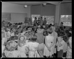 Unidentified classroom with children watching TV