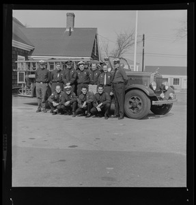 Group of uniformed men with Barnstable District fire truck