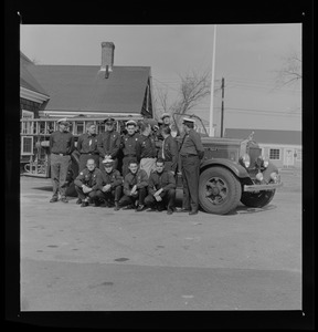 Group of uniformed men with Barnstable District fire truck