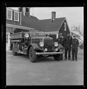 Three uniformed men with Barnstable district fire truck