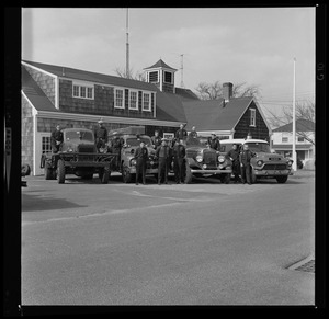 Three uniformed men with Barnstable district fire truck
