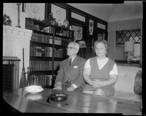 Unidentified couple seated on couch
