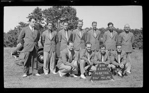 Group of men in suits with "Cliff Martel and his Music" sign, n.d.