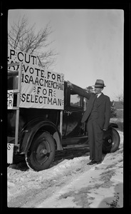 Man with truck covered with sign "Vote for Isaac Merchant for Selectmen" n.d.