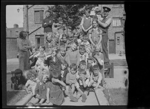 The caretaker of St. Ultan's Flats and a group of children who live there