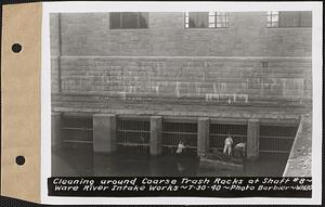 Cleaning around coarse trash racks at Shaft #8, Ware River Intake Works, Barre, Mass., Aug. 30, 1940