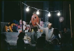 People next to toy display at night