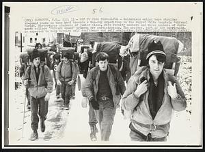 Off to Find Themselves- Holderness School boys shoulder 40-pound packs as they head towards a ten-day expedition in the rugged White Mountain National Forest. Forty-three students of junior class, five faculty members and three members of Dartmouth college "Outward Bound" program are participating. The project, part of the curriculum, is expected to help develop self confidence and self evaluation.