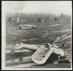 Planes Wrecked by Tornado-These light planes were among 10 smashed by a tornado which struck a small airport in Alabama.