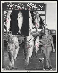 All in a Day's Fishing--Mrs. Ellie B. Galvin of Newton Centre displays two grouper, 124 and 119 pounds, and five amberjack caught aboard Capt. George Bransford's charter boat, Lady's Baby, off Fort Lauderdale, Fla.