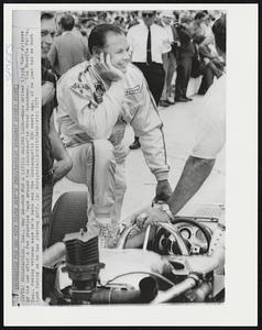 Indianapolis, Ind. – Now For A Little Racing Luck – Race Driver Lloyd Ruby relaxes by his car after a few practice laps around the Indianapolis Motor Speedway. The Wichita Falls, Tex., racing veteran says he’s have won the Indianapolis 500 years ago if he just had as much luck racing as he has playing golf.