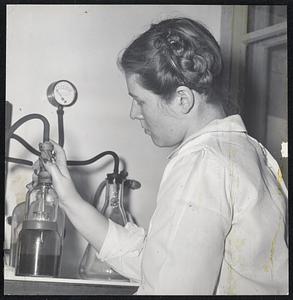 Work at The State Antitoxin Laboratory on serums and vaccines in the incubating room is Leslie Welterlow, assistant bacteriologist. (2) They are checked by Gerald Fraser, laboratory assistant, and Dr. Geoffry Edsall, directories. (3) Mrs. Phyliss Delaney separates the various segments of the blood