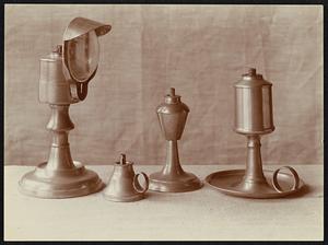 VII From left to right: portable lamp with reflector; petticoat lamp; common form of pewter lamp; guest room lamp.