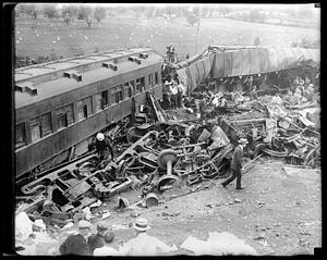 People looking at wreckage of a train accident