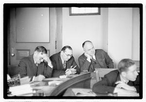 Group of men at table