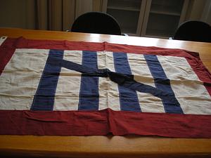 Banner with white ground with four blue stripes