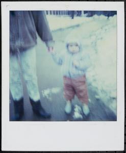 Toddler walking in the snow