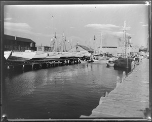 Wharves, one with boats tied up on shore, and fishing boats tied up, Marblehead, MA