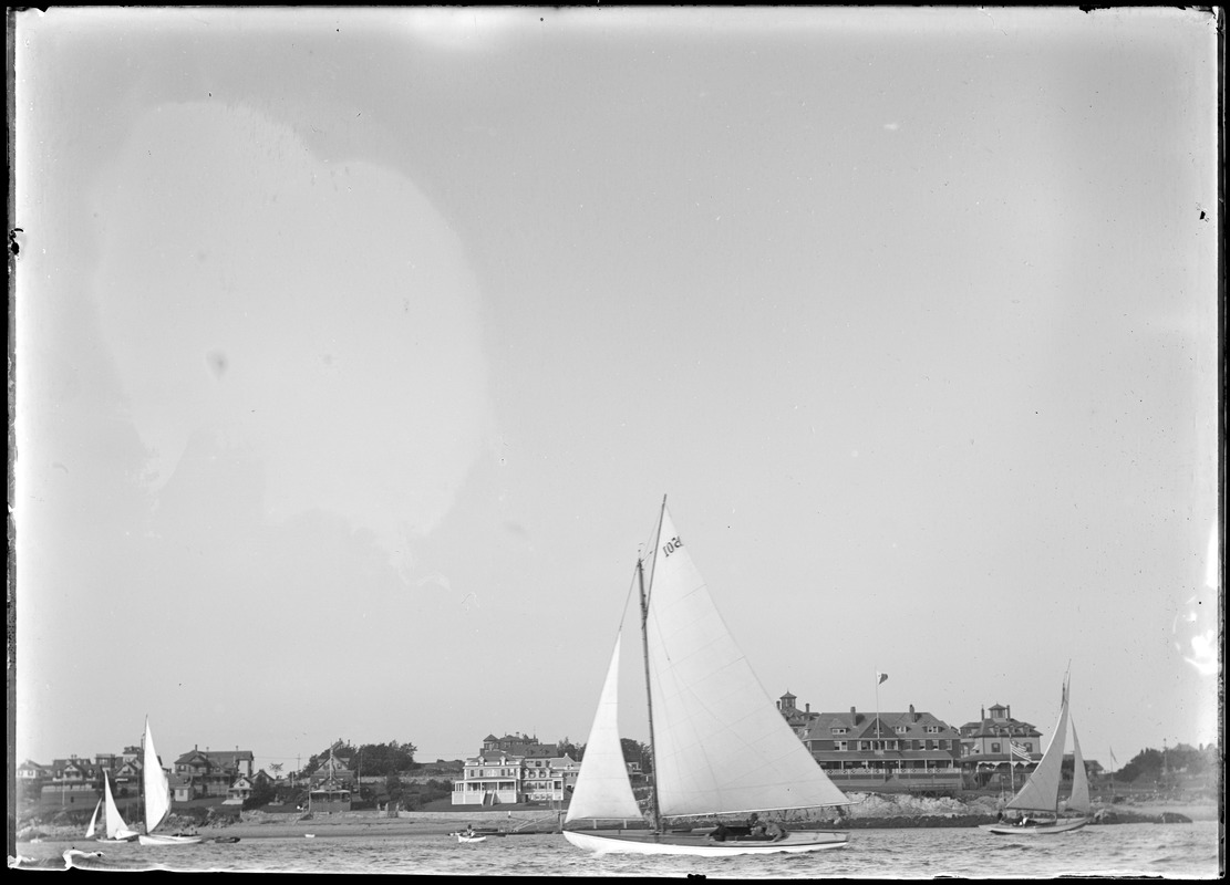 Boats sailing past Corinthian Yacht Club, Marblehead, MA