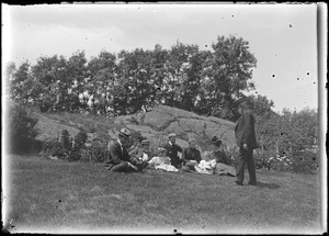 Charles W. Parker (standing) with others seated on the ground, Marblehead, MA