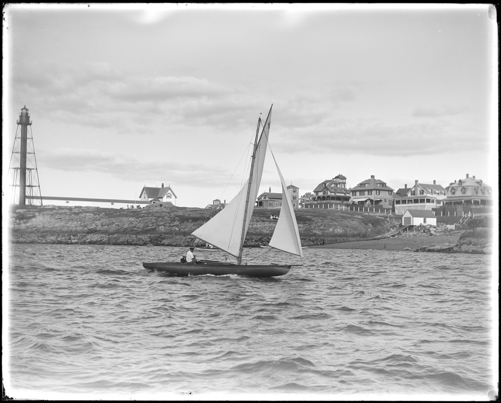 Boat sailing into Marblehead Harbor past Marblehead light tower