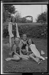 Four girls posing in garden