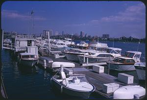 Docked boats with Boston skyline in distance