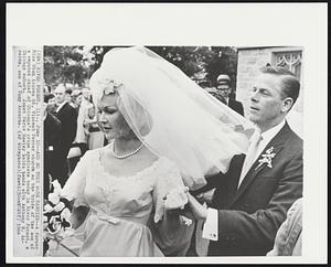 And so they were married--A former Miss Utah leaves St. Vincent Ferrer church as the bride of the son of a reputed chief of Chicago’s crime syndicate today in River Forest, a Chicago suburb. Janet Marie Hawley holds hands with Anthony R. Accardo, son of Tony Accardo.