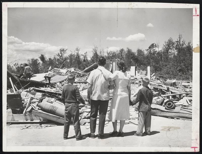 Surveying the Wreckage of their home on Brentwood Drive, Holden, are Mr
