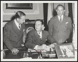 Support Jewish Appeal. Gov. Tobin signs statement calling for support of the combined Jewish appeal of Greater Boston which will be launched at a rally to be held at the Garden Sunday night. Left is Herman Gilman, chairman of the campaign. Milton Kahn (right) is chairman of the rally which will raise funds to help Jews abroad.