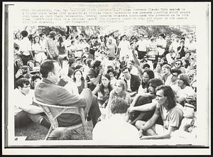 Wicker Chair Conference -- Florida Governor Claude Kirk seated in a wicker chair talks with students at Florida State University an answers question about events this week at Kent State University. Several hundred students surrounded the governor as he told them, "Let's keep this on a personal basis". The governor plans to stay all night on the campus with the students.