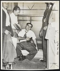 Striker is Stabbed-Dominick Zeoli, one of the striking New York newspaper deliverers, photographed just after he was stabbed in the chest by boys who attempted to take newspapers from an office he was picketing. He is clutching the wound.
