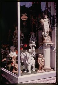 Sculptures inside of a window