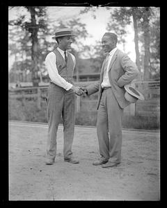 Two unidentified men shaking hands