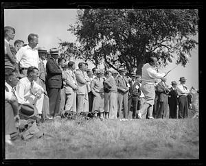 Spectators watching Gene Sarazen play golf