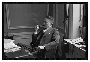 A man seated at a desk