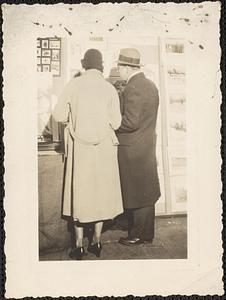 A man and woman photographed from behind