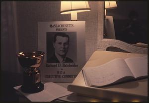 Still life with sign promoting Richard D. Batchelder for NEA Executive Committee