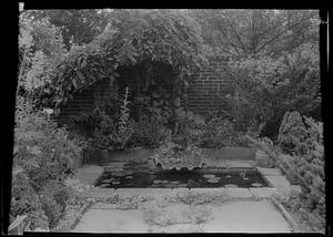 Alcove with Cupid statue in garden of Mrs. W. H. Cary