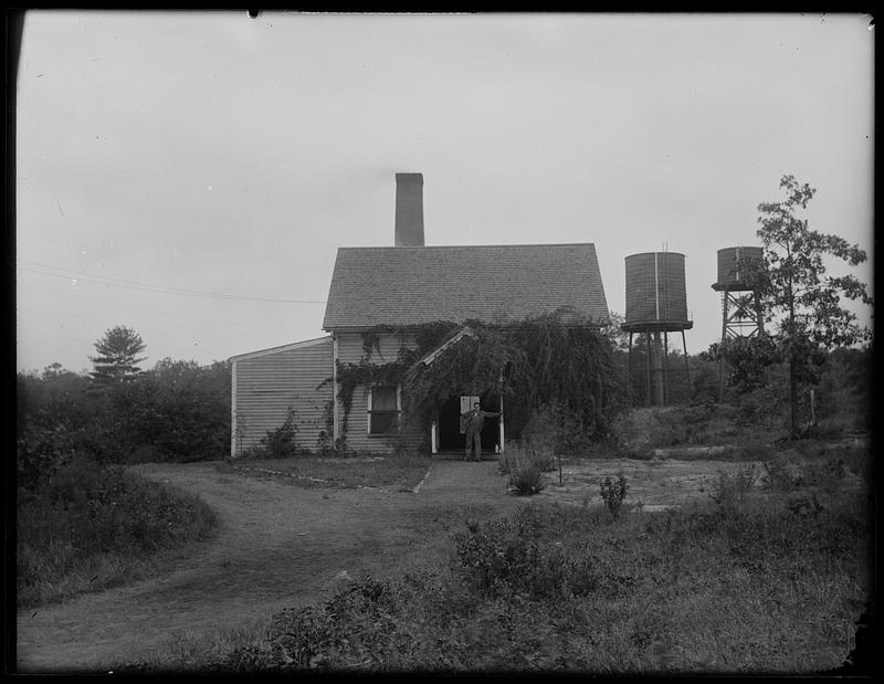 Person standing in front of a house