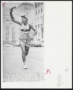 He Wants To Run To New York -- Don Shepherd, 48, a golf miner from Johannesburg, South Africa, who describes himself as an amateur marathon runner, waves today as he leaves Los Angeles City Hall at the start of a 3100-mile run to New York City. He said he hopes to complete the run in 69 days, averaging 4 miles a day.