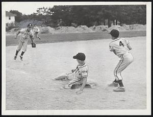 Snuffed Out as he tried to return to third after breaking for home is Kilburn Childs of the Needham Little League Yankees. Braves third baseman John Peterson made the tag.