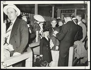 Warlike Scene as Canadian immigration inspectors scrutinize papers of 300 passengers who sailed last night for Yarmouth, N.S., on Eastern Steamship Lines’ steamer Yarmouth. Drastic American regulations become effective today.