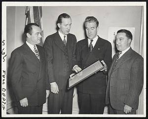On Hub Payroll - Mayor John E. Kerrigan (second from right) and three legislative members who hold extra jobs. They are (left): Rep. Dennis F. Glynn of Roxbury, commitment officer at $2300 in penal institutions department; Rep. James McDevitt of Charlestown, guidance officer at $2200 in the institutions department, and Rep. John E. Powers of South Boston, who holds $2400 post as head clerk in the city welfare department.