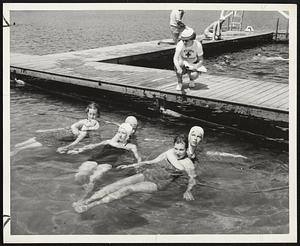 Rescue Techniques - The cross-chest carry is demonstrated above by, left to right, Joy Reid, Athol, and Judy Rogers, Belmont; Janet Wulff, Springfield, and Diana Lowe, Lynn, and Pat Roberts, South Hadley, and Joyce Beiring, Weston.