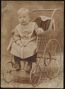 Willis Hanscom shown at two years old, sitting in a baby carriage