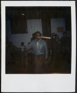 Boy in silver jacket dancing