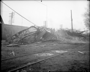 Unidentified. Storm wreck? Appears to be wooden railroad coaches.