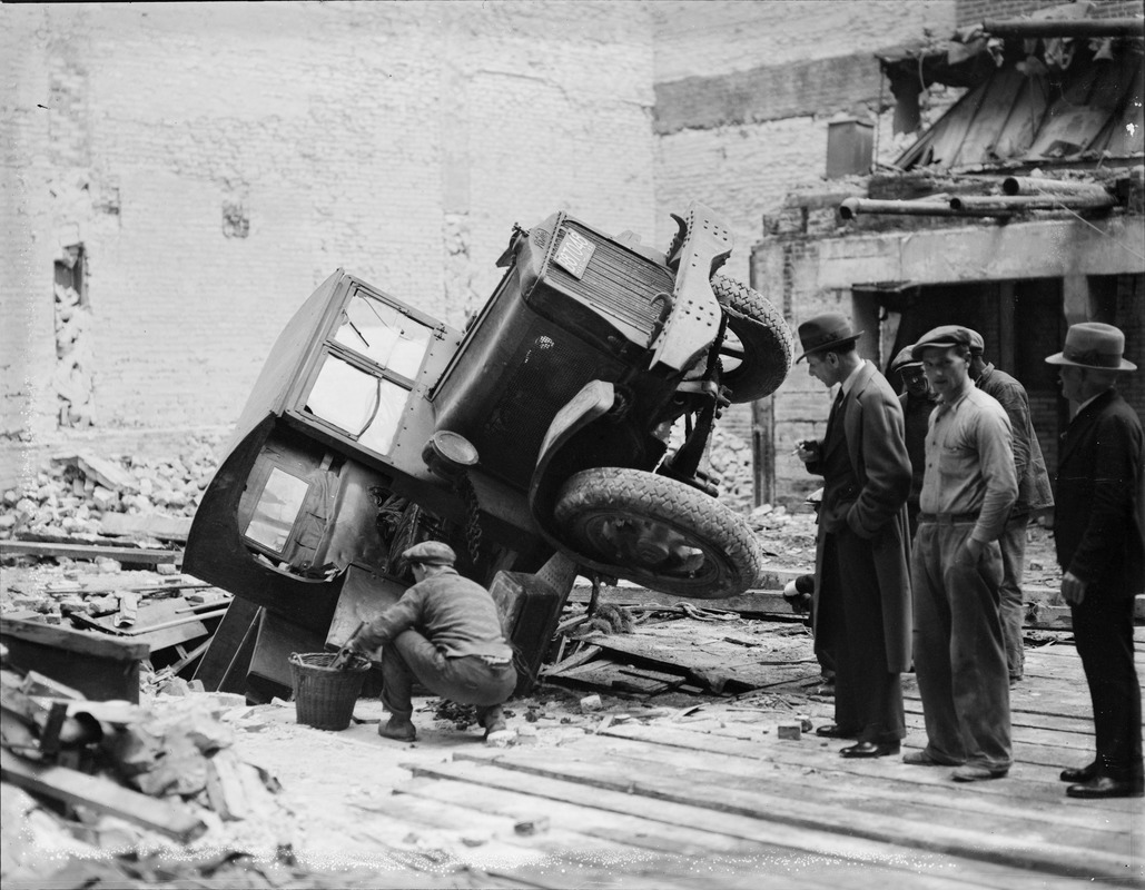 Truck goes into hole during Adams House demolition