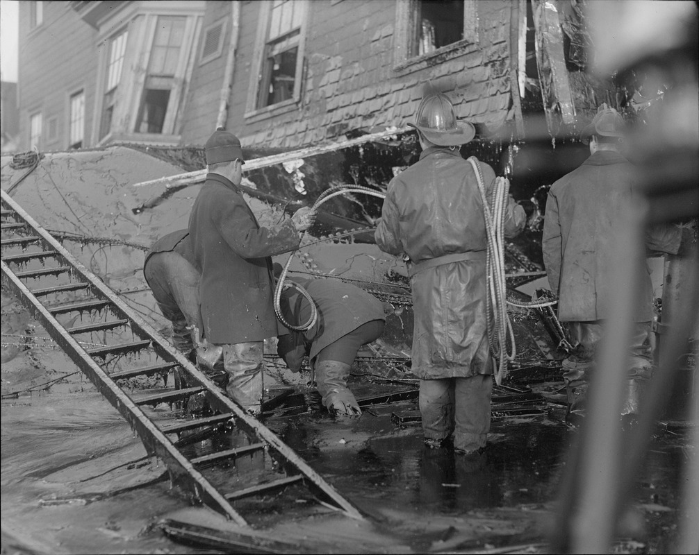Firemen standing in thick molasses after the disaster